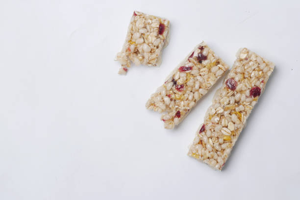 istock Almond , Raisin and oat protein bars on white background 1418063469