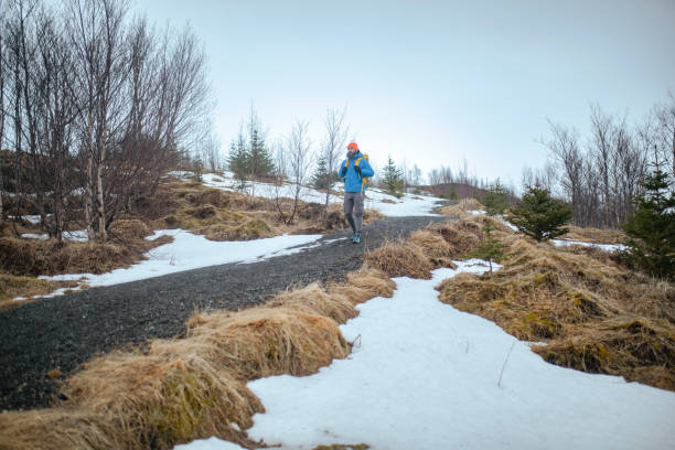 A full-length view of a mountaineer changing to a mountain. ISL
