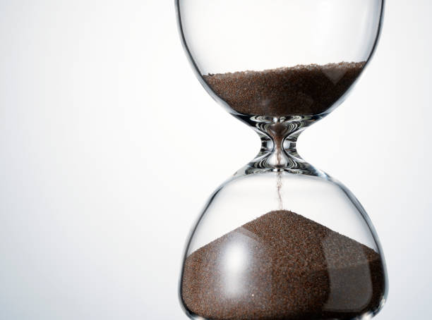 istock An hourglass placed on a white background. 1418072347