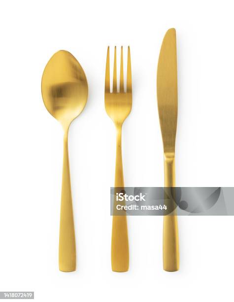 Gold Knives Forks And Spoons Placed On A White Background Beautiful Gold Cutlery Stock Photo - Download Image Now