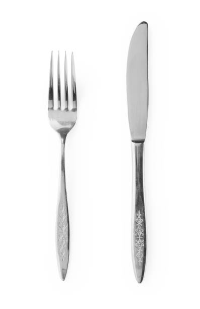 istock Silver knives and forks placed on a white background. Retro cutlery. 1418072443