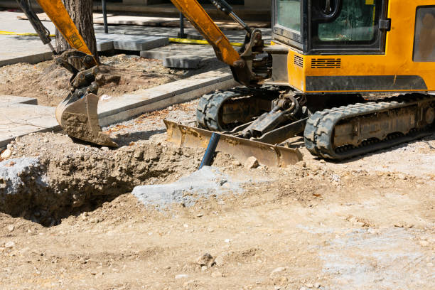 Excavator on urban street Picture of an excavators machine in construction site earthwork stock pictures, royalty-free photos & images