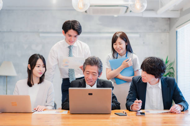 istock Businessperson happily working in an office 1418076078