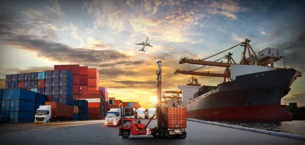 istock Logistics and transportation of Container Cargo ship and Cargo plane with working crane bridge in shipyard at sunrise, logistic import export and transport industry background 1418080546
