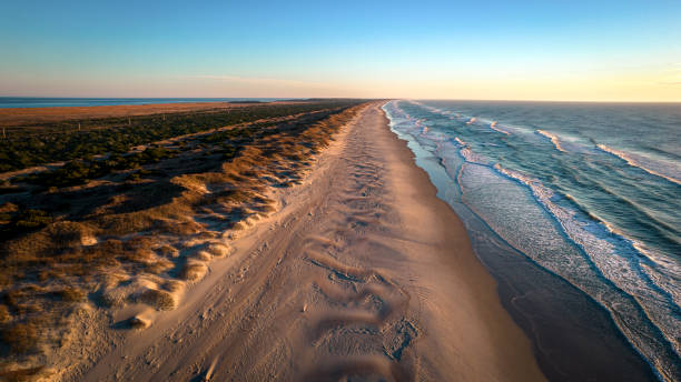 Aerial view of coastline and sand dunes stock photo