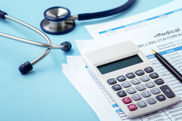 istock Medical bill concept with calculaotor and stethoscope on blue background 1418084838