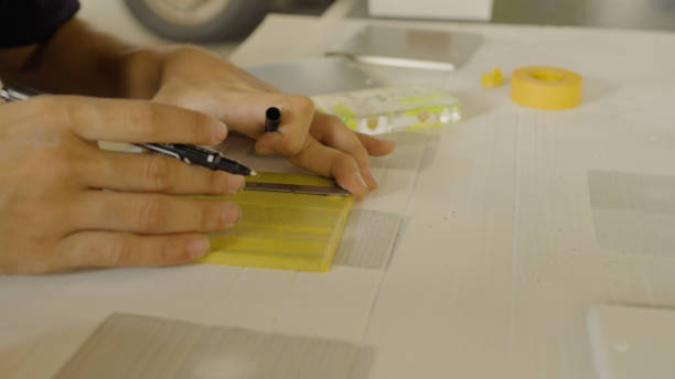 istock The men draw lines on masking tape. 1418105066
