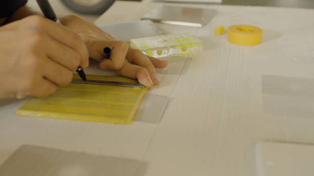 istock The men draw lines on masking tape. 1418105085