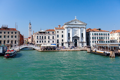 Venice, Italy - July 26, 2012: Passenger water transport pier near the Chiesa della Pietà church in the Grand canal in Venice