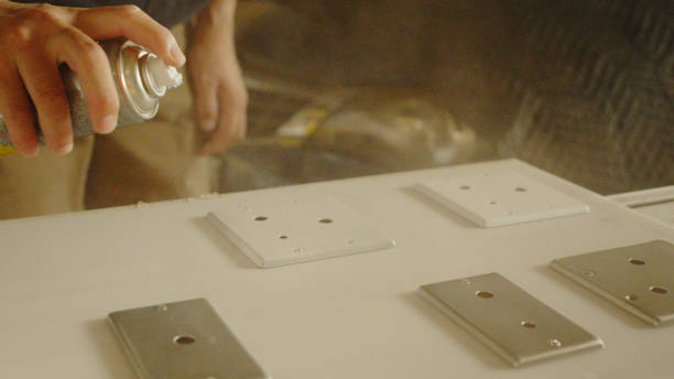 istock The men carefully paint electrical materials. 1418109884