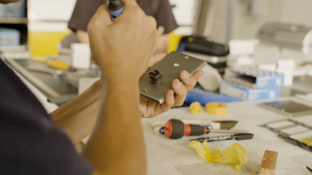 istock Man is widening a drilled hole. 1418109885