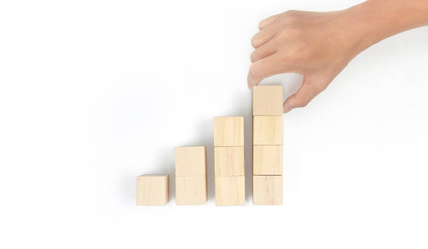 istock Business connecting piece of multi wood chart blocks steps in hand 1418110020