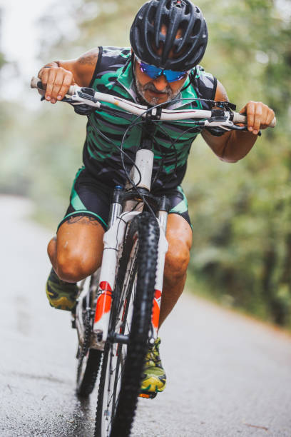 istock male mountain biker riding in a forest 1418110539