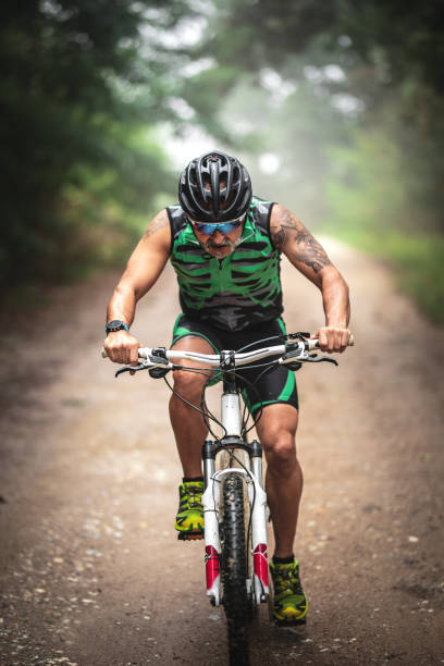 istock male mountain biker riding in a forest 1418110627