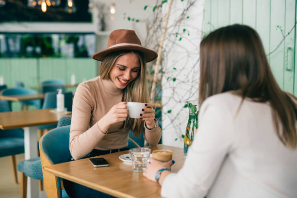 istock woman friends in cafeteria 1418111459