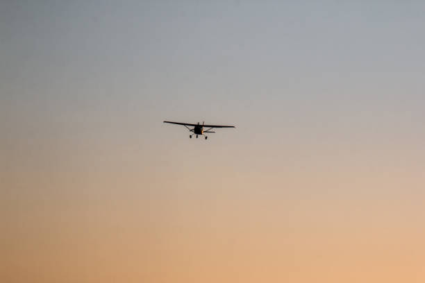istock Light Aircraft Flying On Twilight Sky in Namibia. 1418111588