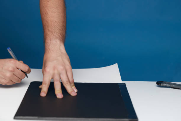 istock Person marking with a ballpoint pen on a poster board 1418111643