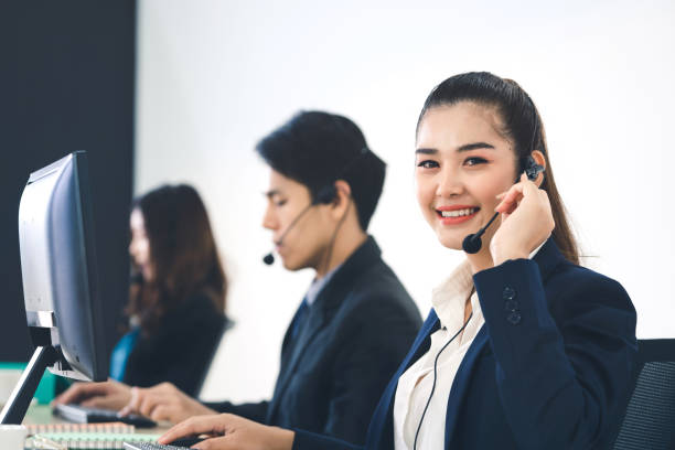 istock Young business staff asian woman working with headphone and computer for support. 1418112751