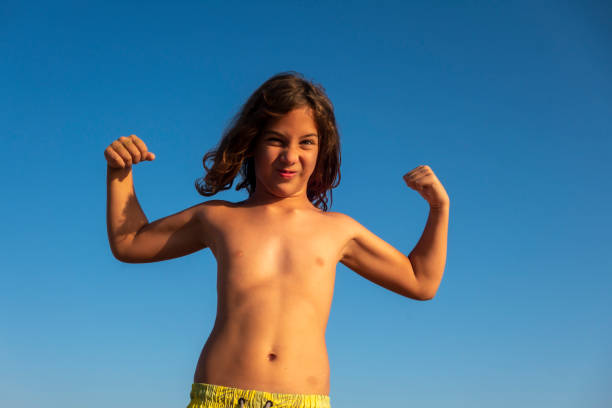 istock Boy having fun in sea 1418116256