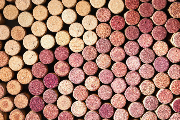 istock Wine cork background from red and white wine, natural texture used bottle stoppers top view. Closeup wooden corks. Natural textured stoppers colored wallpaper. Bright background wine corks 1418116972