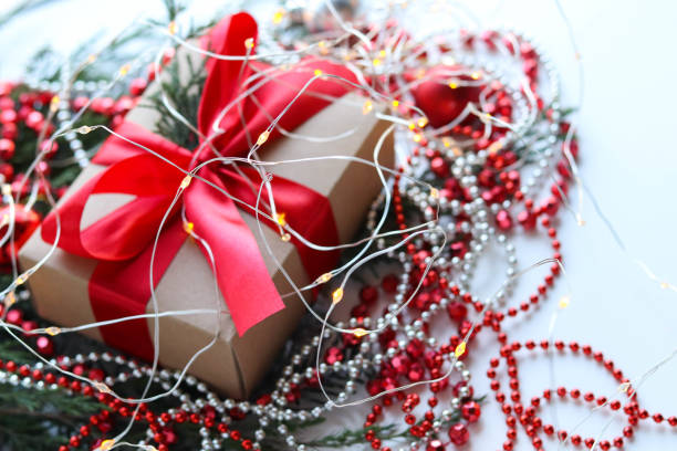 istock fir branches, christmas tree decorations, garlands and a gift box with a bow 1418117359