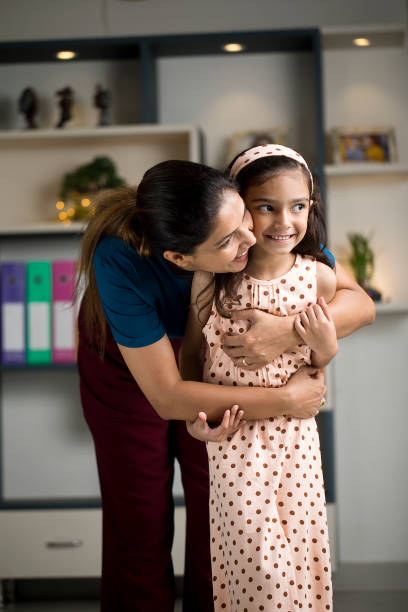 istock Girl having fun with her mother at home 1418117979