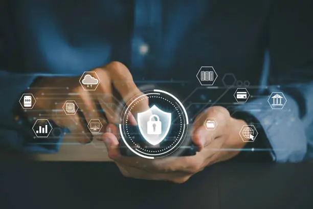 Photo of Concept of cyber security, information security, and encryption, secure access to user's personal information,  Man using his mobile selects the icon security on the virtual display. cybersecurity.