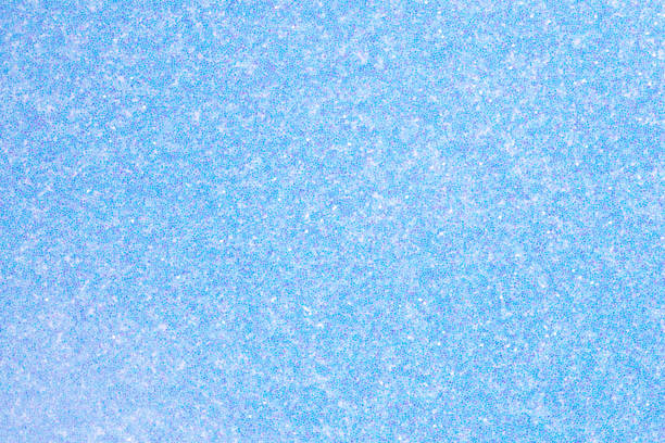 istock Shiny light blue glitter texture for individual holiday gift card. 1418118392