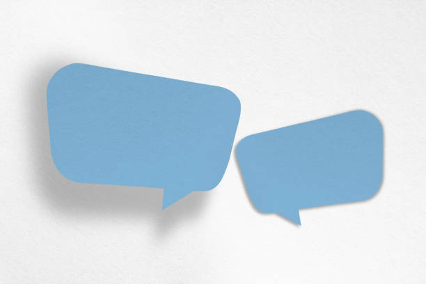 istock Speech balloon shaped blue paper isolated on white background. 1418119547