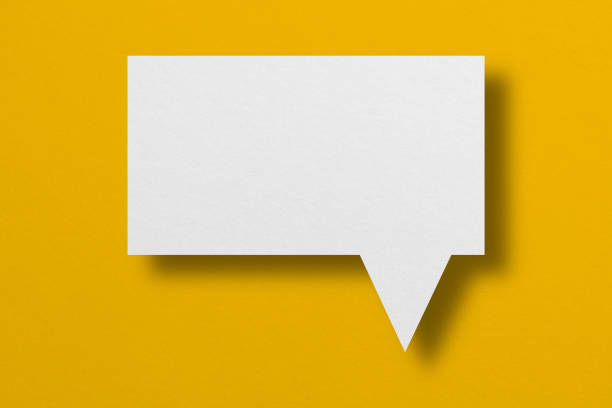 istock speech balloon shape white paper isolated on yellow background 1418119564