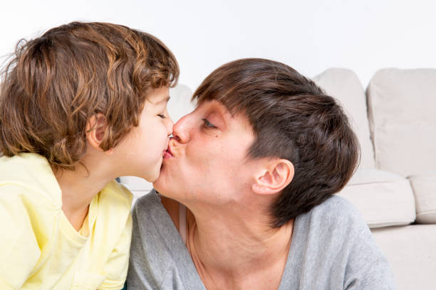 istock Mother and son kissing 1418119722