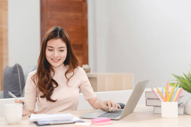 istock Asian beauty Work online from home via computer Interacting with the team Is a new normal online activity 1418125119