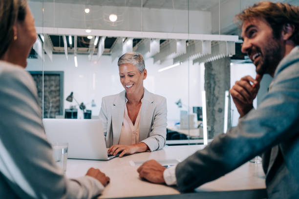istock Group of business persons talking in the office. 1418128055