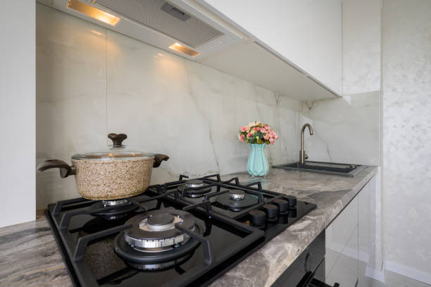 istock Gas stove and worktop closeup at white modern domestic kitchen 1418128131