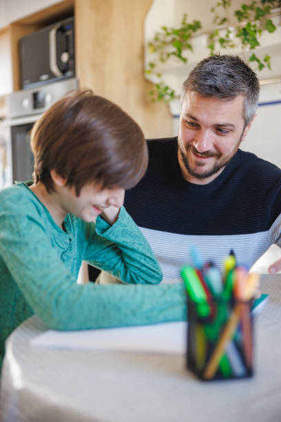 istock Tutor and home-schooled boy working on subject and having fun 1418133841