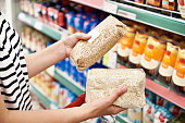 Packages of cereals in hands of buyer