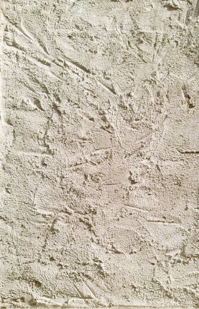 istock Textured background. Decorative wall plastering, external facade finishing. Texture in natural color. Putty 1418136074