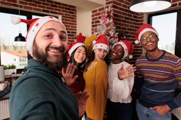 istock Multiethnic group of people taking pictures with tree 1418137680