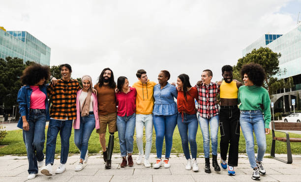 istock Young diverse people having fun walking together outdoor 1418143467