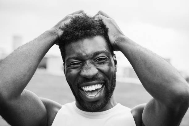 istock African transgender man with makeup smiling on camera outdoor 1418143482