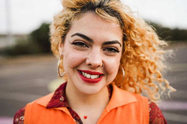 istock Happy young girl smiling on camera outdoor 1418144721