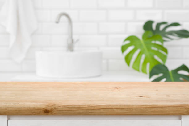 istock Classic wood texture table for product display before blurred bathroom 1418146035