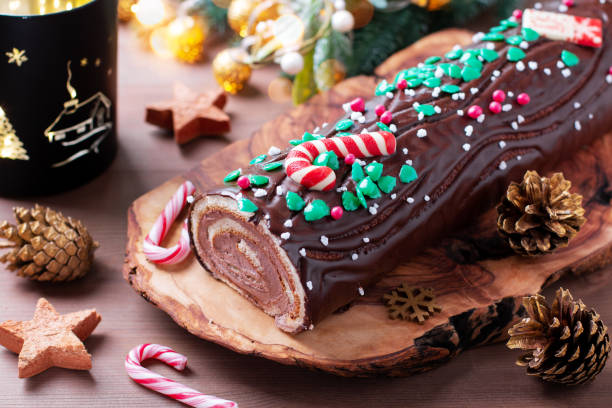 istock Traditional chocolate trunk cake or log cake on table with Christmas decorations 1418148037