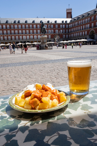 Aioli and bravas potatoes in Plaza Mayor in Madrid, Spain. Typical Spanish tapas