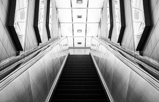 Looking up a moving escalator at subway station