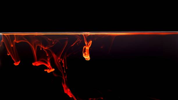istock Orange colorful fluorescent smoke on black background,Art abstract smoke texture,Colored liquid dye,Splash paint,Abstract color,Abstract Textures 1418154212