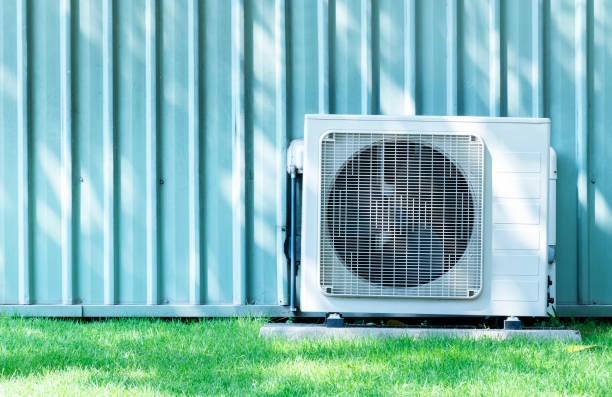 istock Compressors air conditioners on grass field 1418156894