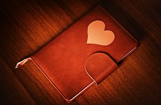 Vignetting Photo of Red Heart Shape on the Book closeup