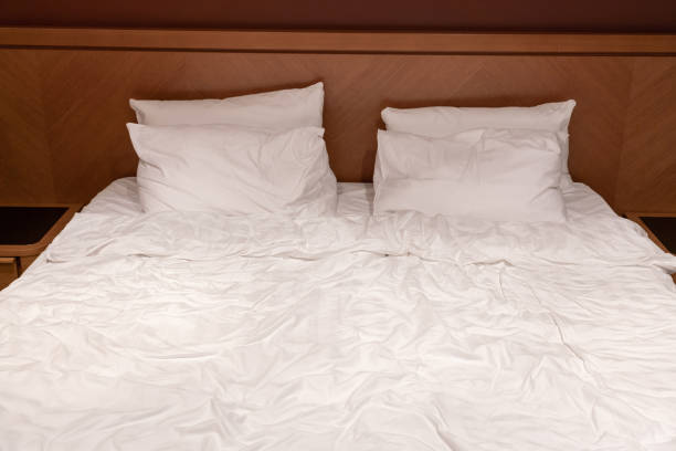 istock Double bed with snow-white linen after the night 1418158249