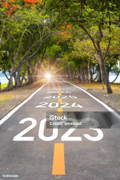 Five Years From 2023 To 2027 On Asphalt Road Surface Stock Photo - Download Image Now